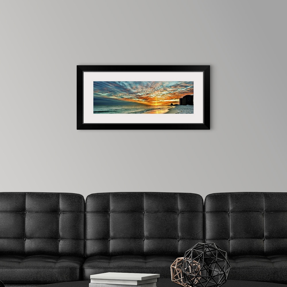 A modern room featuring A magnificent red skyscape in this panoramic sunset. Landscape taken on Navarre Beach, Florida.