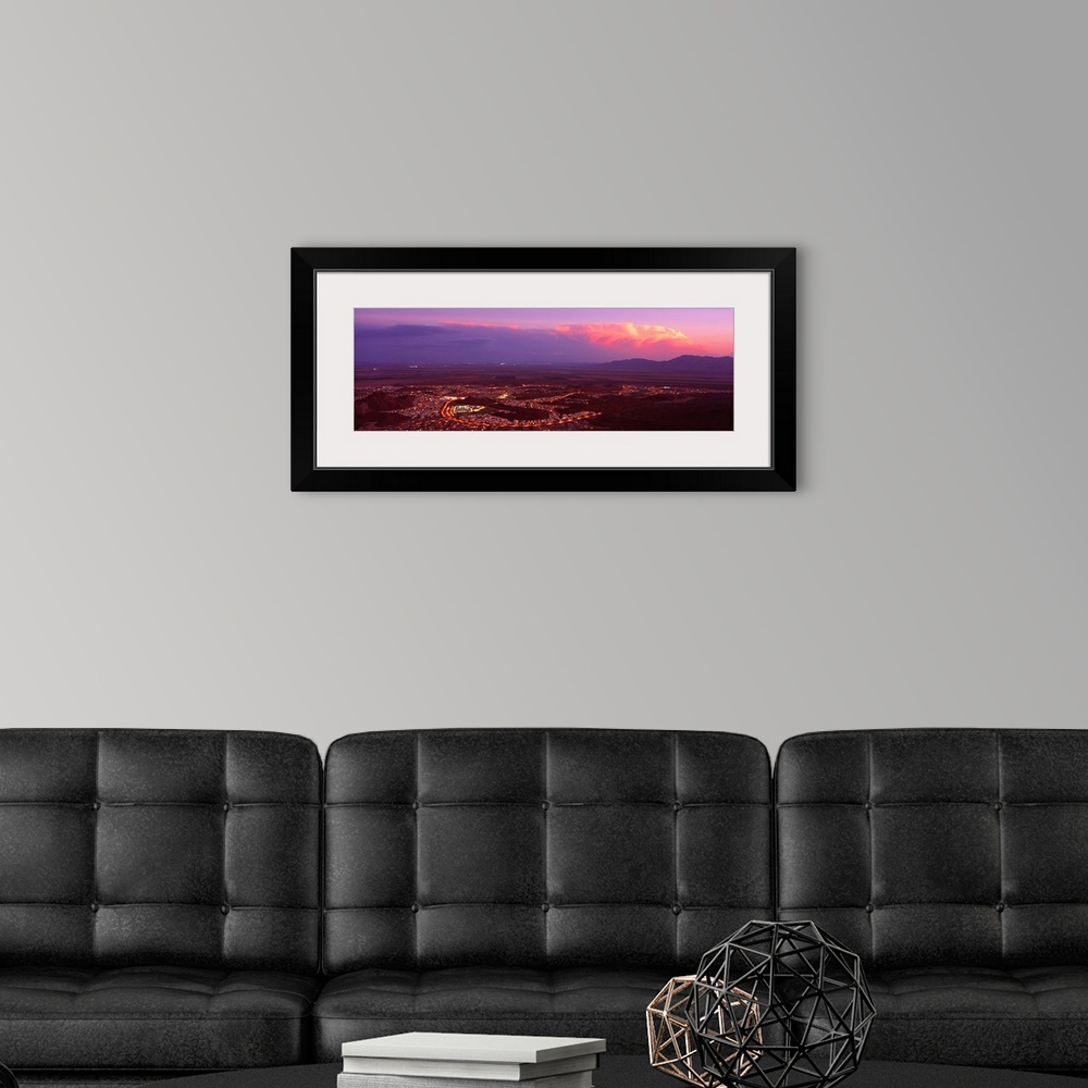 A modern room featuring Aerial view of a city lit up at sunset, Phoenix, Maricopa County, Arizona,