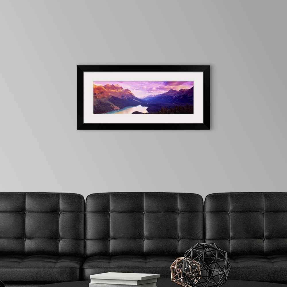 A modern room featuring A colorful sunrise over the mountains of Peyto Lake in Alberta, Canada.