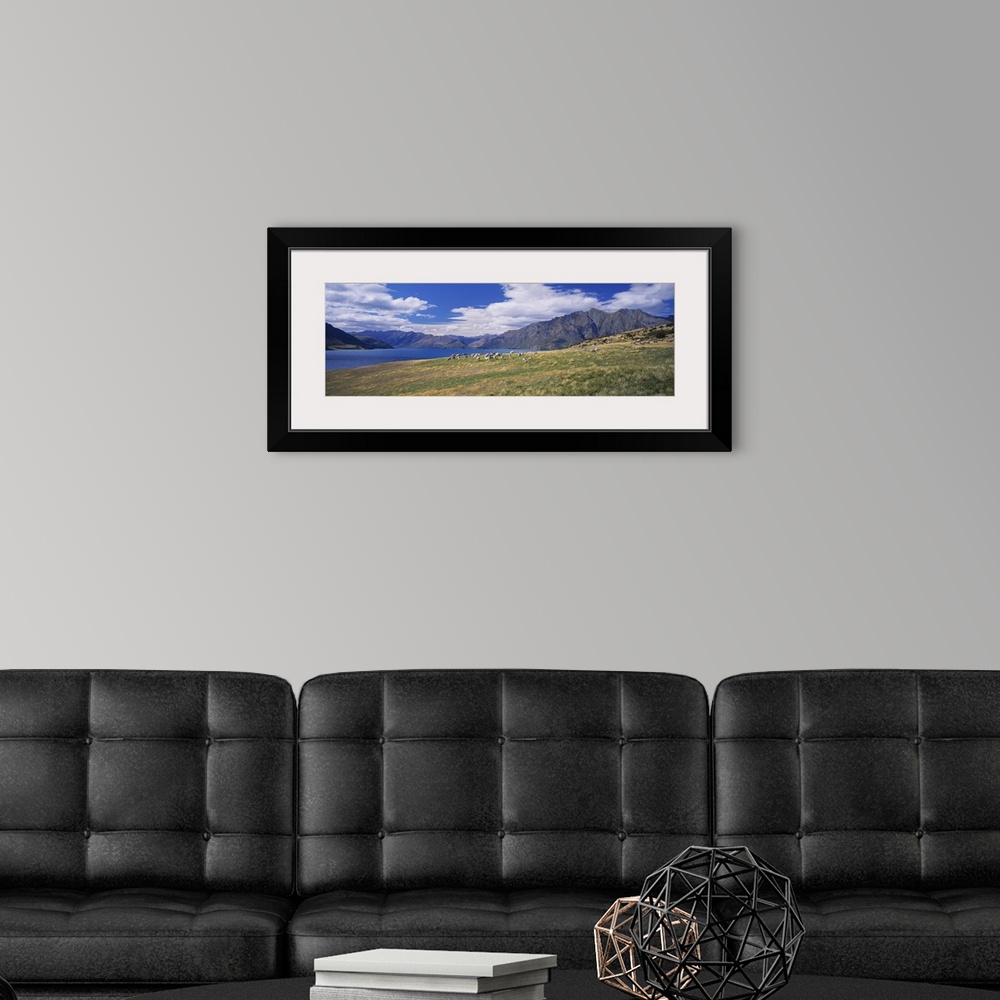 A modern room featuring Clouds over mountains, Lake Hawea, Otago, Wanaka, South Island, New Zealand