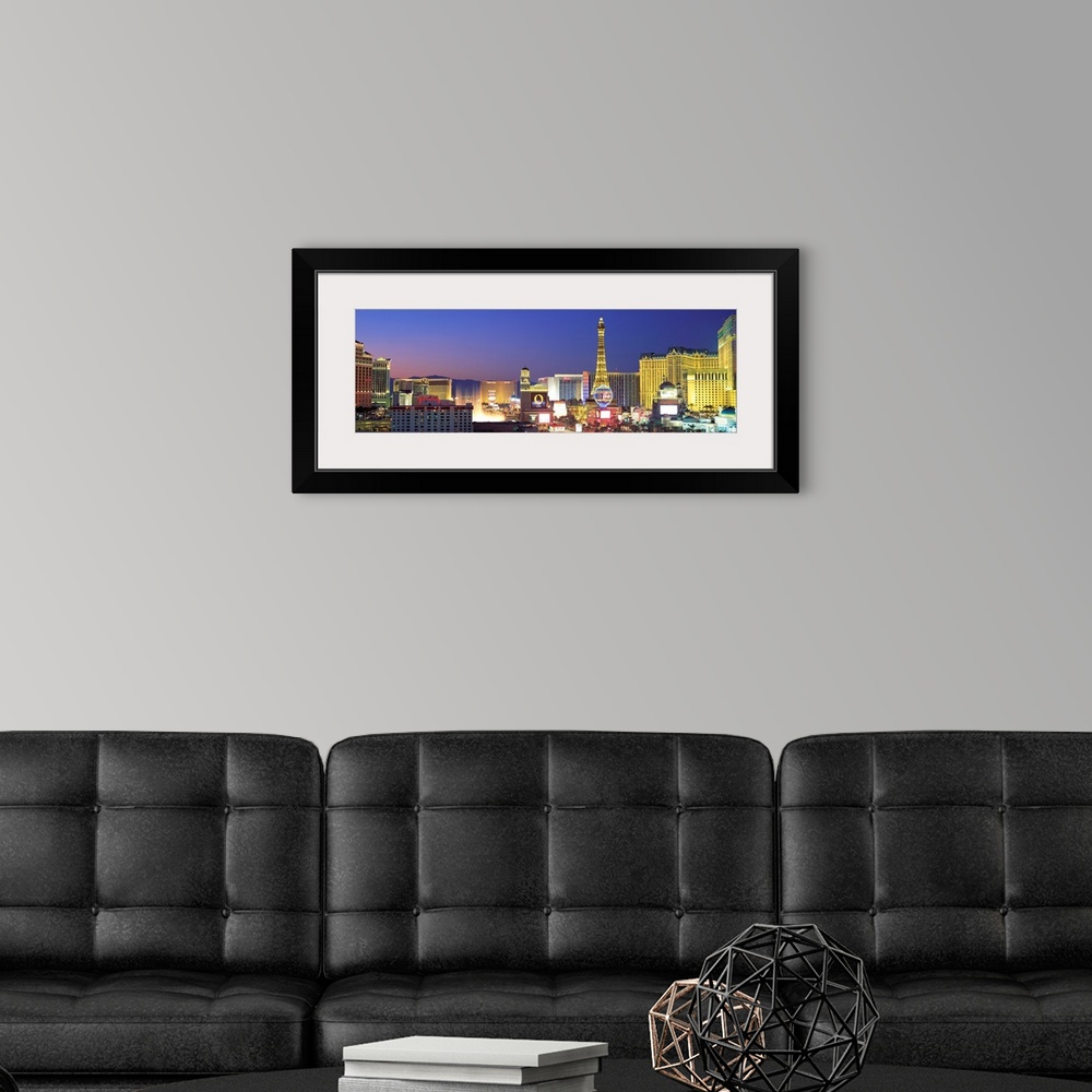 A modern room featuring Panoramic photograph showcasing the bright neon lights of the busy strip in Las Vegas, Nevada at ...