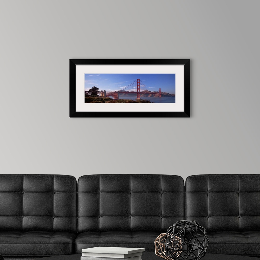 A modern room featuring Panoramic photograph showcases a famous suspension bridge found within the Western United States ...