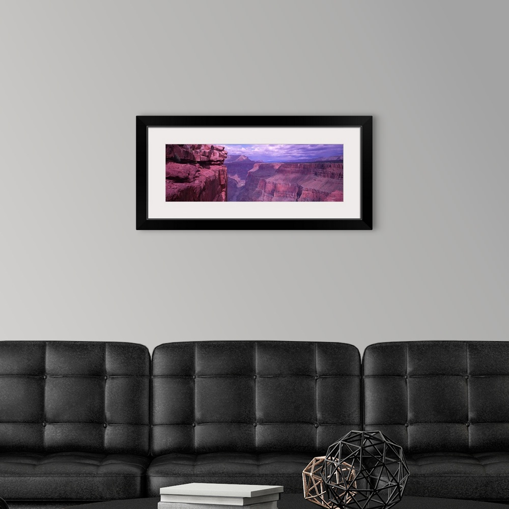 A modern room featuring Panoramic photograph displays a look down the stretch of a famous chasm in the Western United Sta...