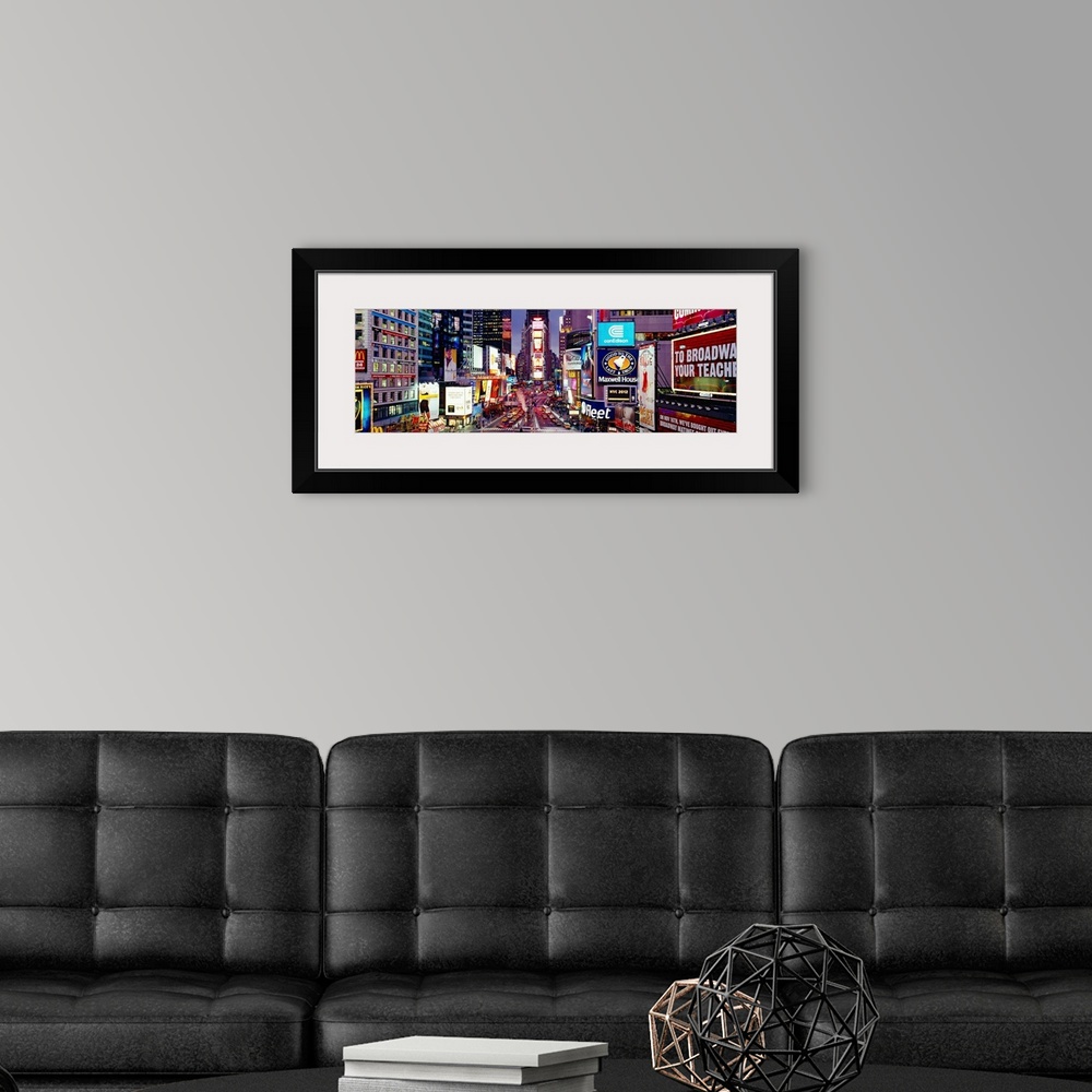 A modern room featuring Panoramic photograph of neon signs and city streets downtown.