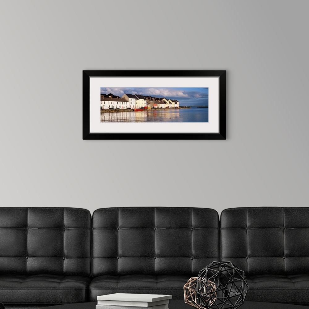A modern room featuring Long horizontal photo print of colorful Irish buildings and houses along the waterfront.