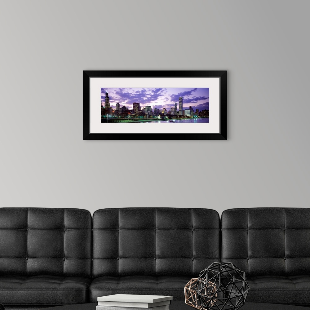 A modern room featuring A panoramic photograph taken on Lake Michigan shows the busy skyline filled with skyscrapers in C...