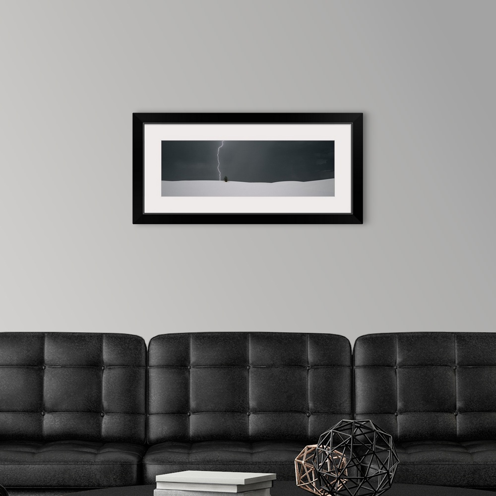A modern room featuring Panoramic photo print of a lightning strike hitting behind a plant near a sand dune.