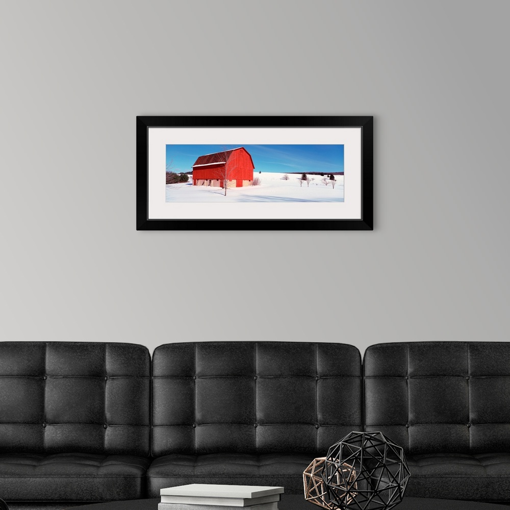 A modern room featuring Michigan, View of a red stable on a snow covered farm