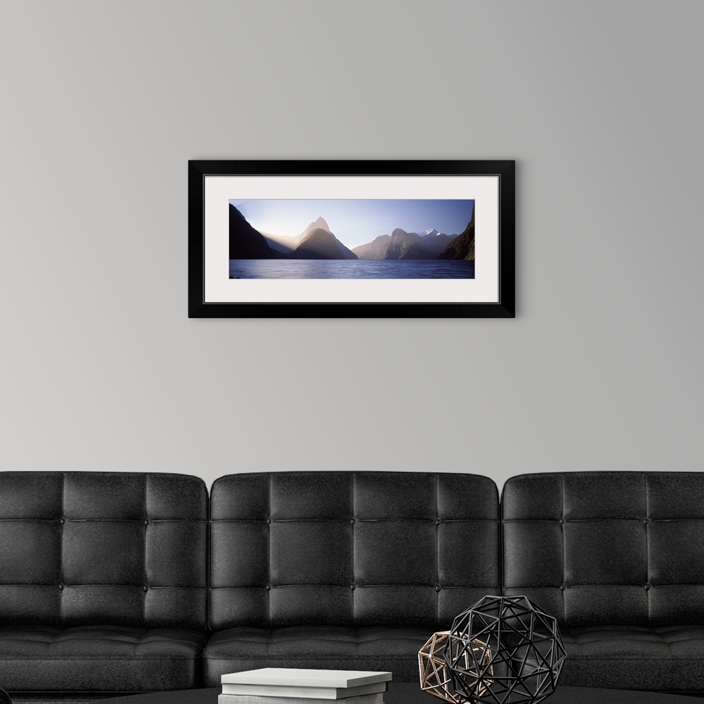A modern room featuring Mountain range at water's edge, Milford Sound, Fiordland National Park, South Island, New Zealand