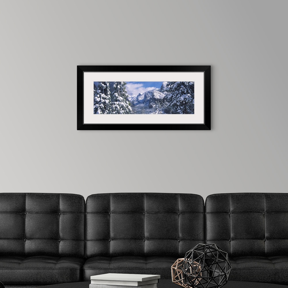 A modern room featuring Mountains and waterfall in snow, Tunnel View, El Capitan, Half Dome, Bridal Veil, Yosemite Nation...