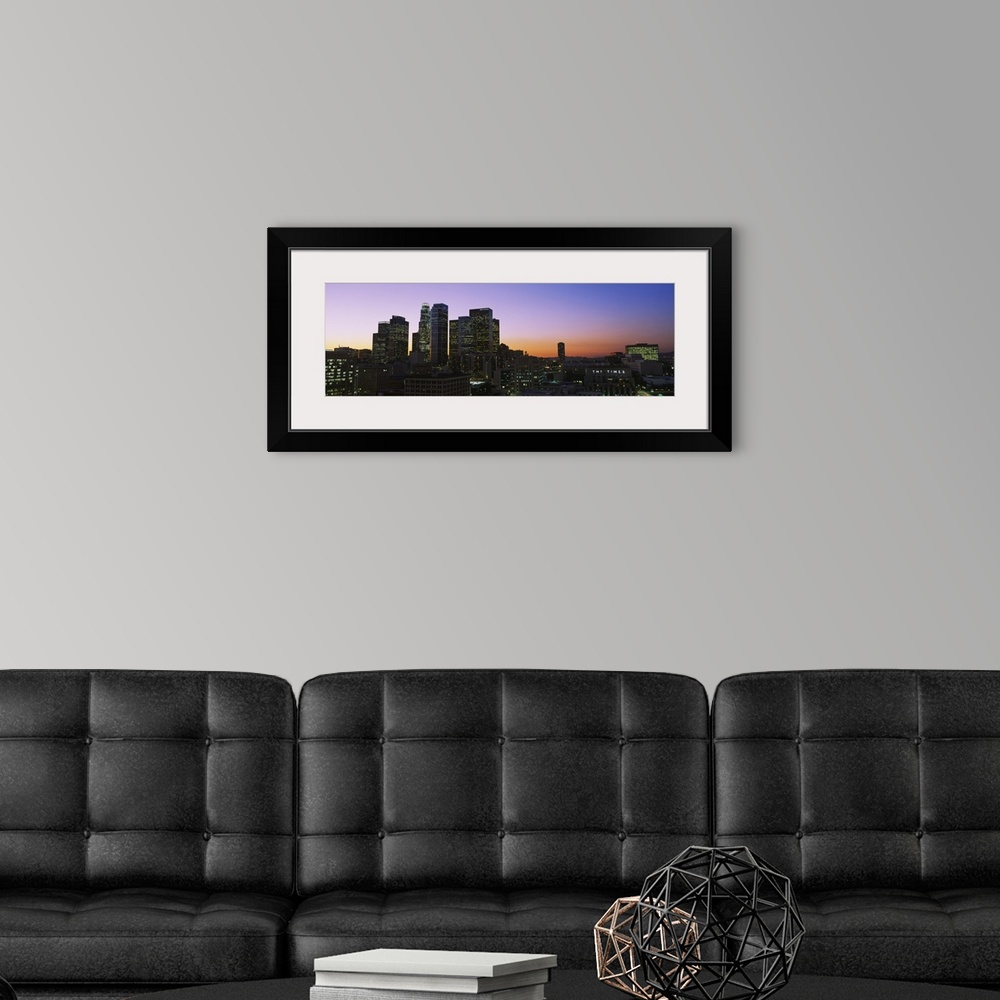 A modern room featuring Silhouette of skyscrapers at dusk, City of Los Angeles, California