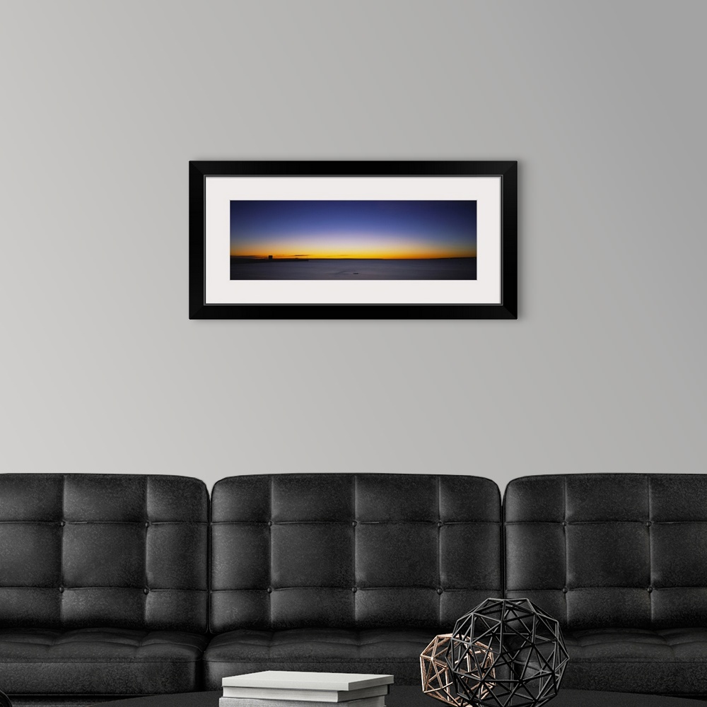 A modern room featuring Sunrise over a lake, Lake Huron, Straits of Mackinac, Mackinaw City, Michigan