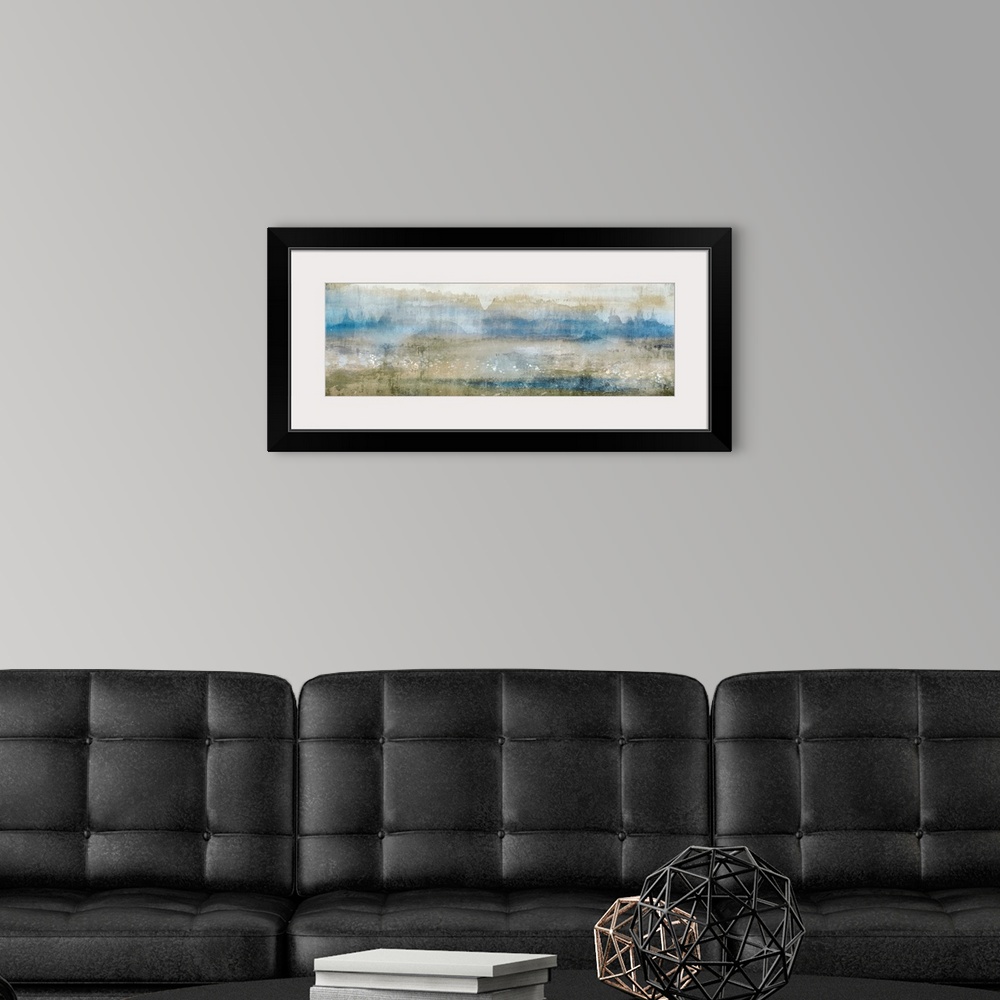 A modern room featuring Abstract contemporary painting in muted blue shades and earth tones.