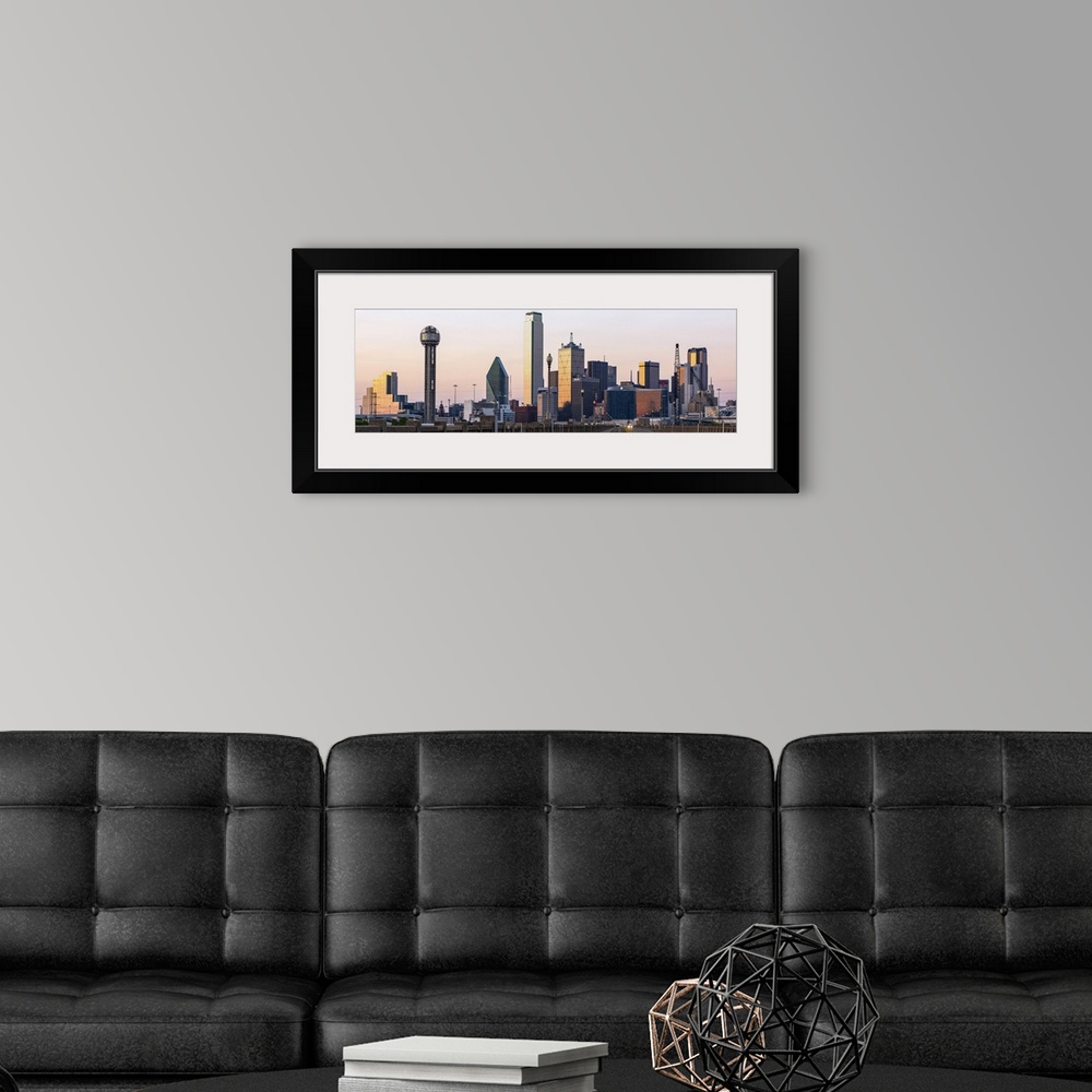 A modern room featuring The city of Dallas, Texas at sunset.