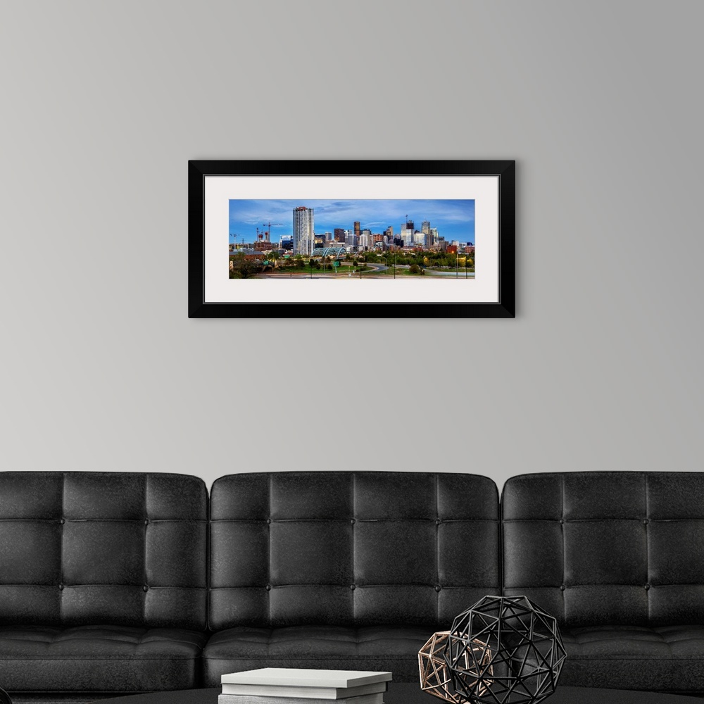 A modern room featuring Photo of a Denver's skyline with light trails.