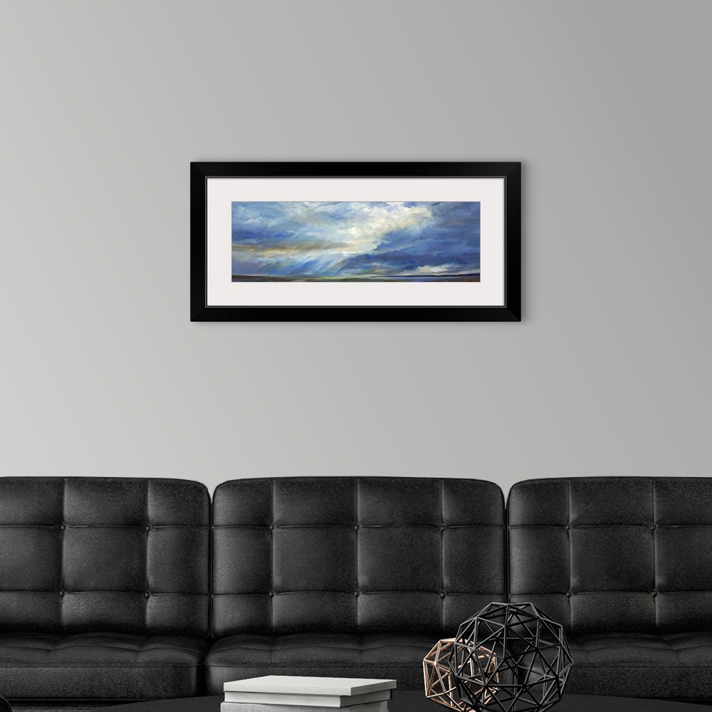 A modern room featuring Contemporary painting of pastel clouds over a quiet landscape.