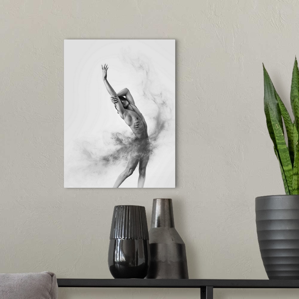 A modern room featuring Black and white fine art photograph of a male model posing gracefully and gray smoke moving aroun...