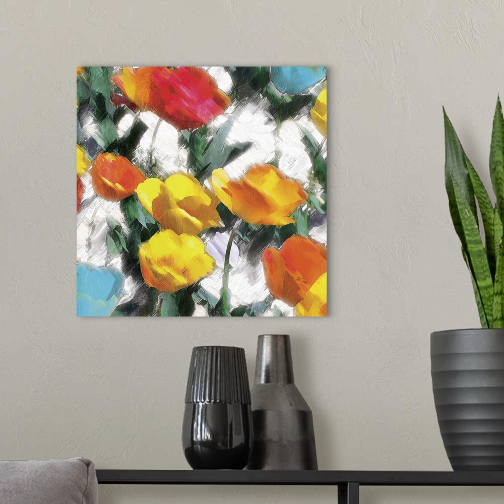 A modern room featuring A bright and colorful abstract painting of yellow, orange, red, and blue flowers on a white backg...