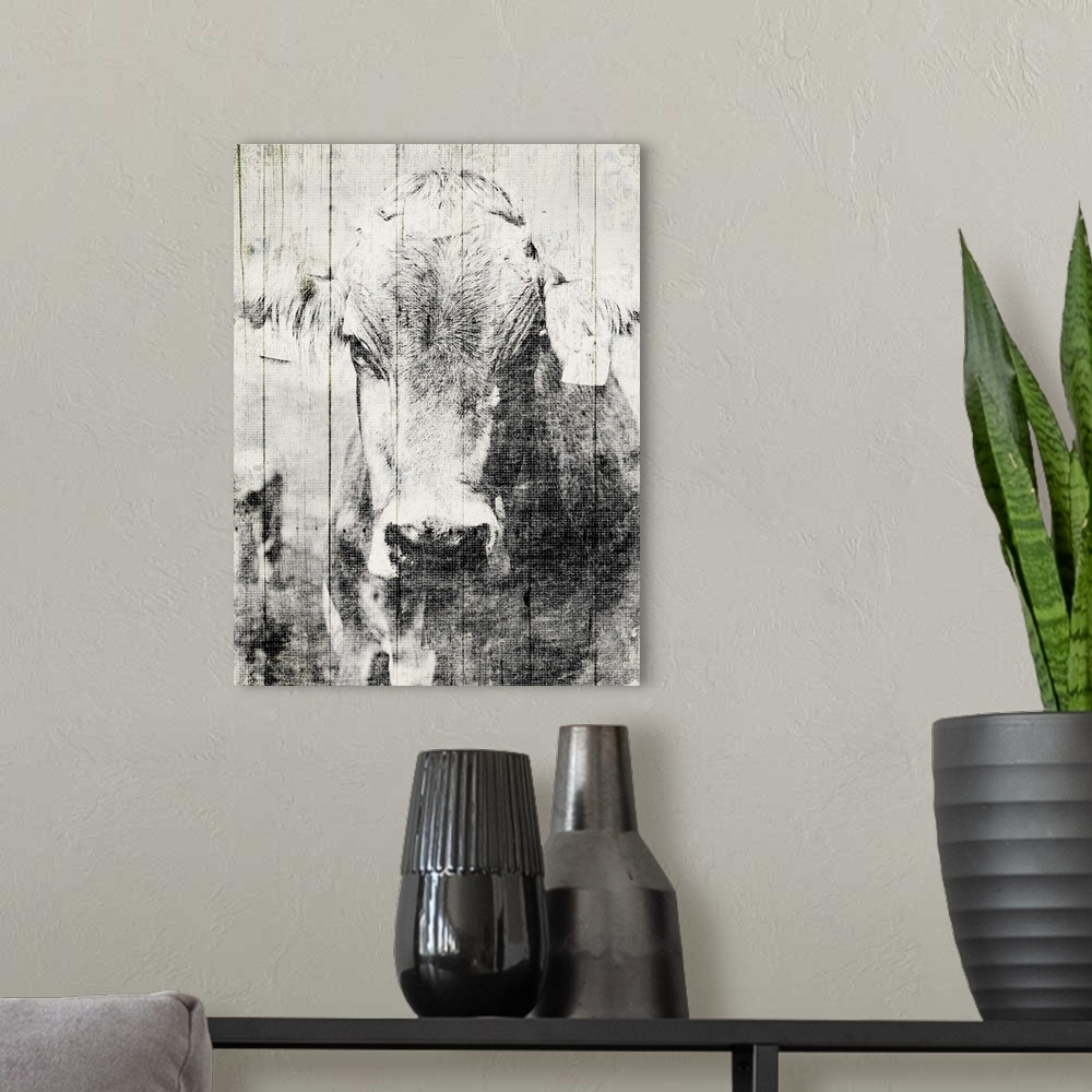 A modern room featuring Contemporary artwork of a cow against a background of rustic wood planks.