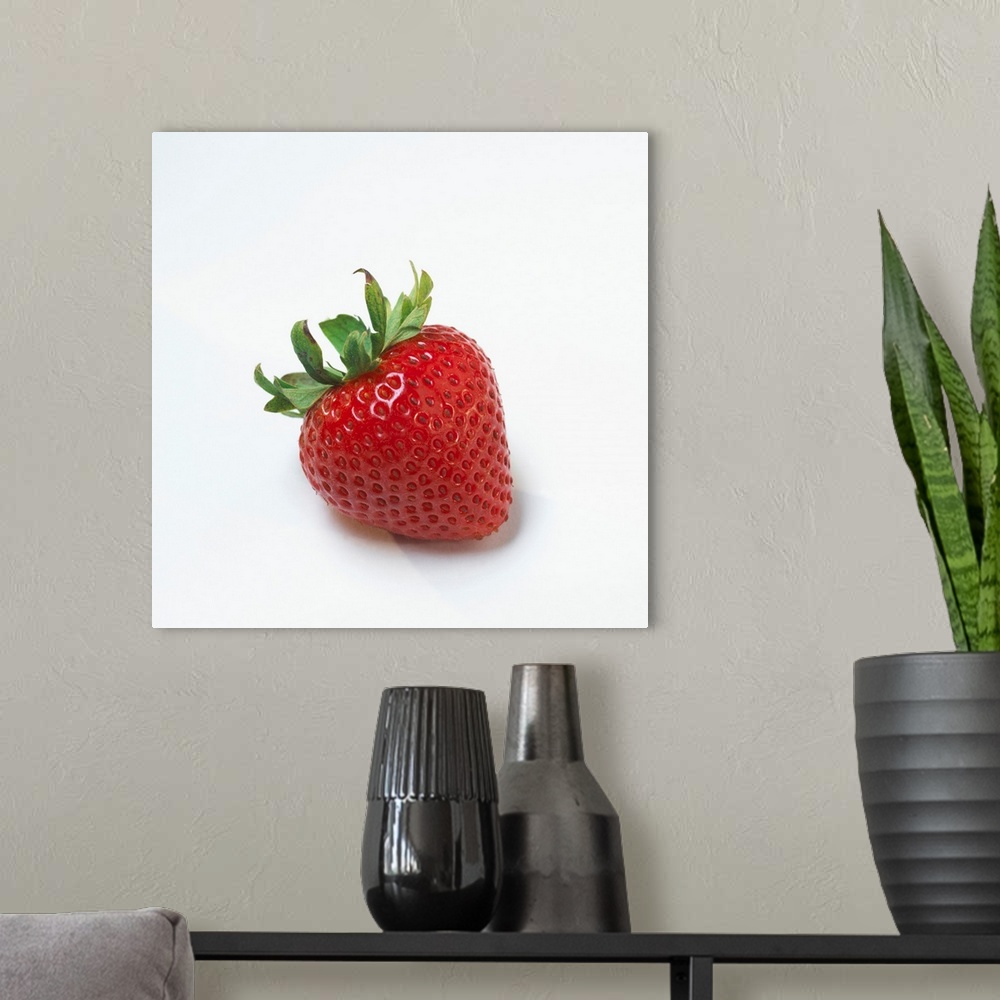 A modern room featuring Fresh Ripe Strawberry Against White Background