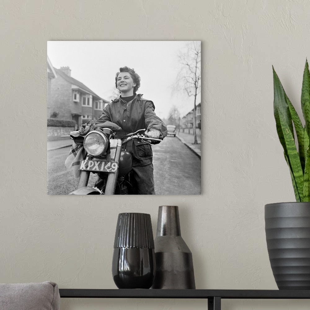 A modern room featuring 3rd March 1951:  June Adams, aged 21, on her motorcycle, who competes in motorcycle trials at wee...