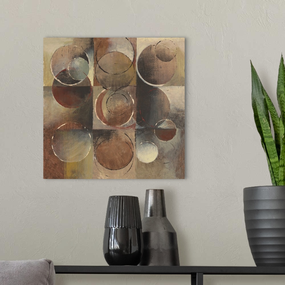 A modern room featuring Abstract painting using geometric and organic shapes in earth tones.