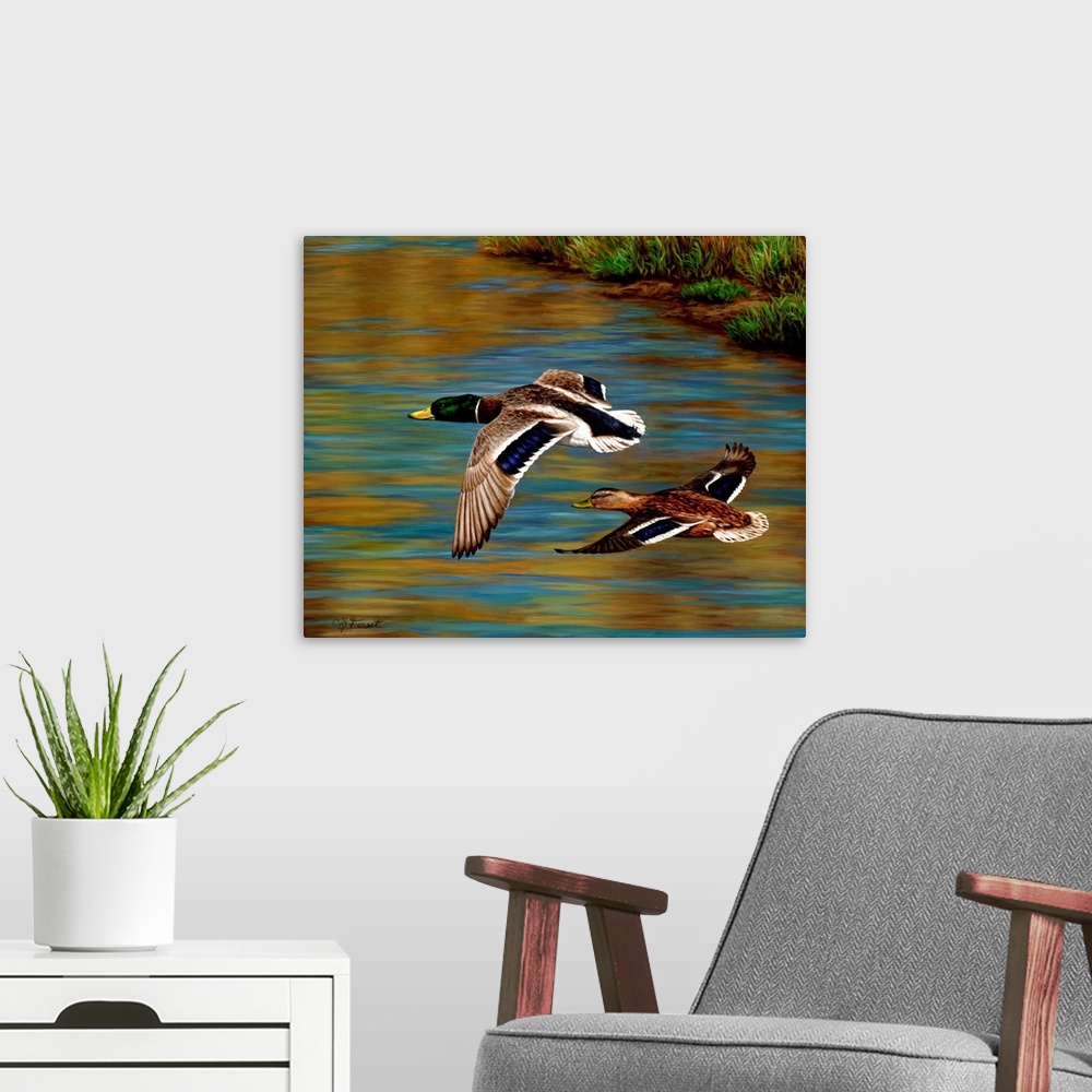 A modern room featuring Two ducks flying over the water