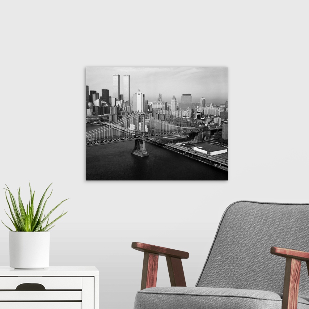 A modern room featuring Manhattan Bridge with Twin Towers behind
