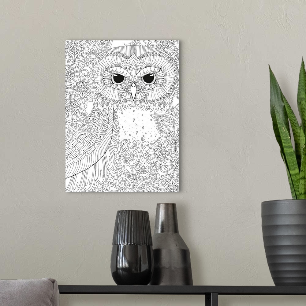 A modern room featuring Black and white line art of an intricately designed owl surrounded by flowers.