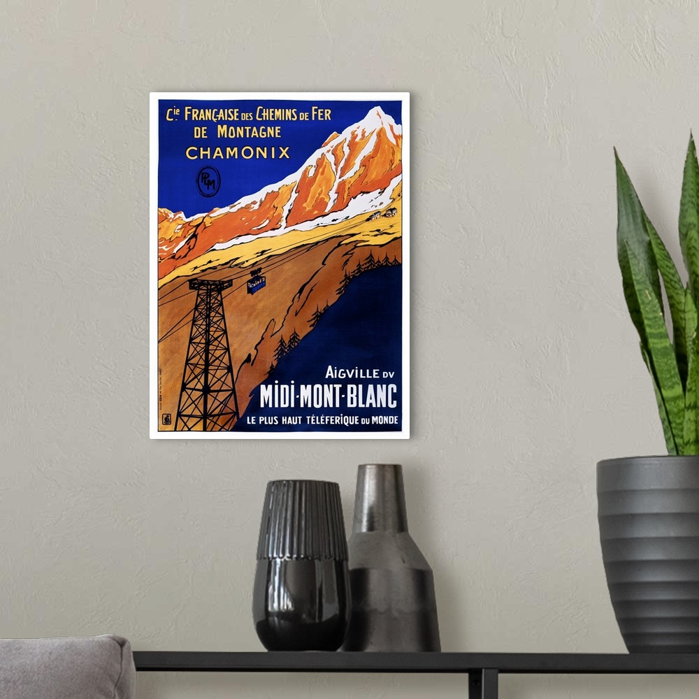 A modern room featuring Vintage travel advertisement artwork for Chamonix rail travel.