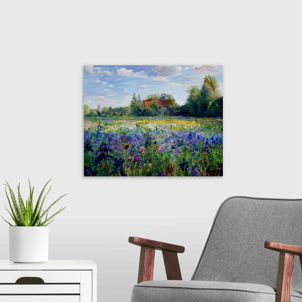 A modern room featuring Painting of house surrounded by trees with forest in the background and colorful flower meadow in...