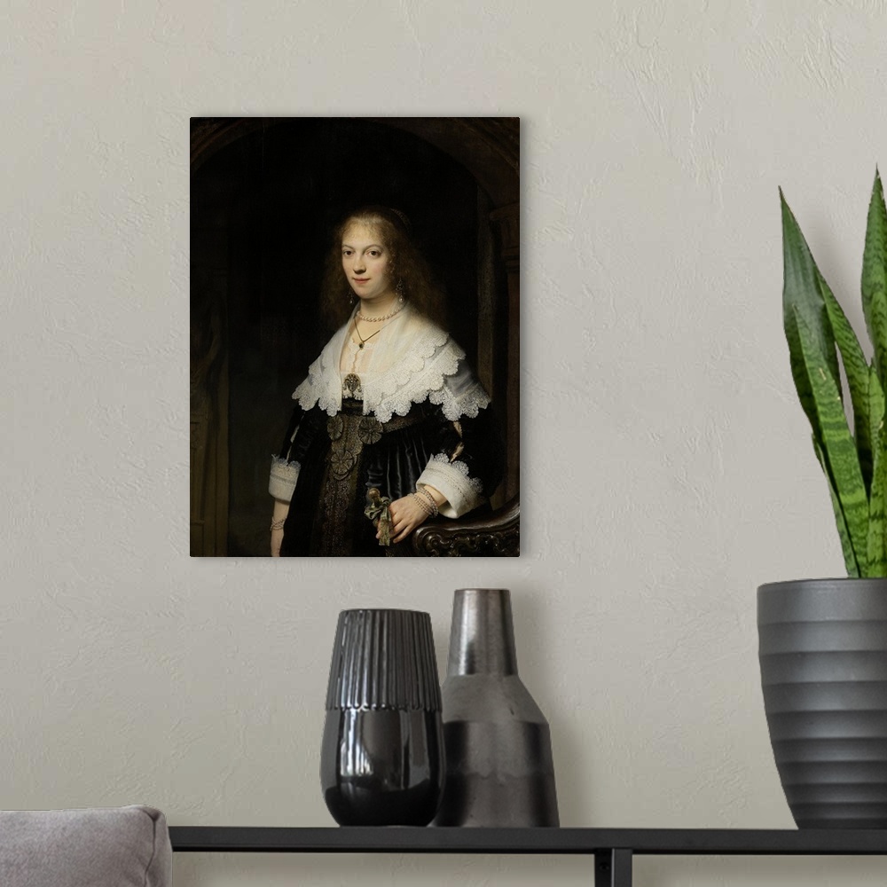 A modern room featuring Portrait of a Woman, possibly Maria Trip, 1639, oil on panel.  By Rembrandt van Rijn (1606-69).