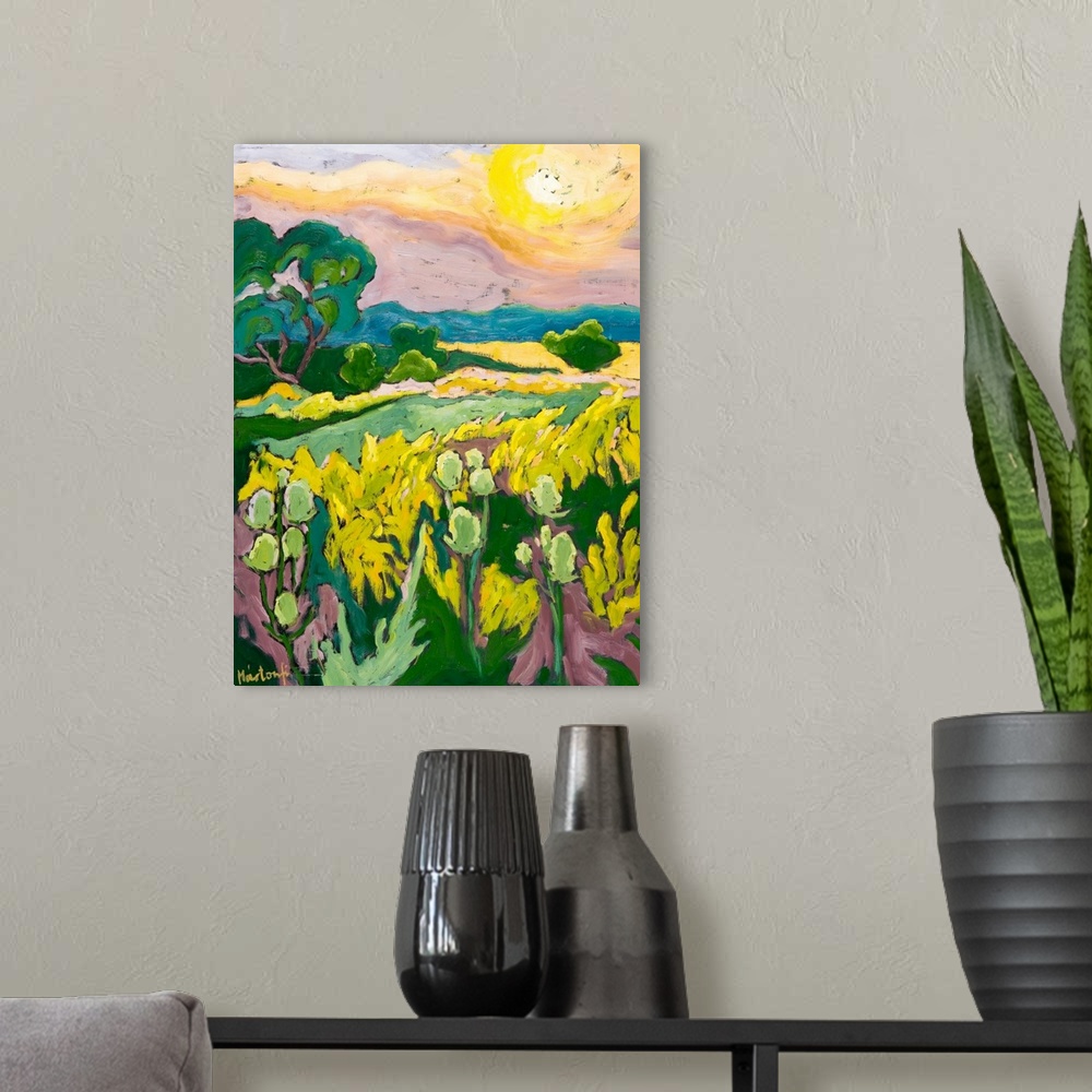 A modern room featuring This vertical landscape painting captures and meadow of wildflowers at sunset with big areas of c...