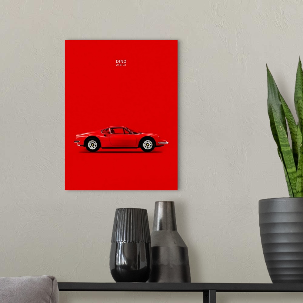 A modern room featuring Photograph of a bright red Ferrari Dino 246GT 69 printed on a red background