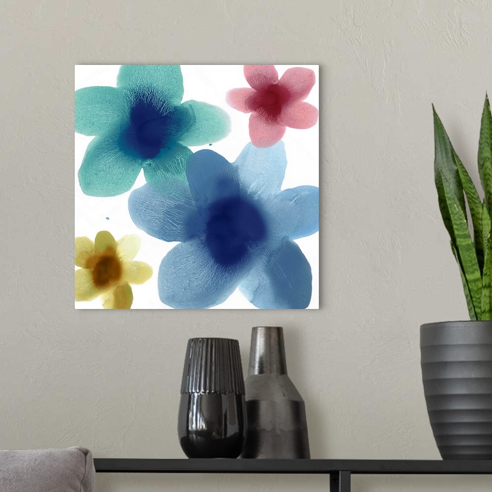 A modern room featuring Square abstract art with floral prints in blue, teal, yellow, and pink on a white background.