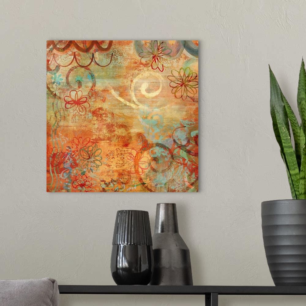 A modern room featuring Square abstract art with warm colors, hints of cool blues, and floral illustrations.