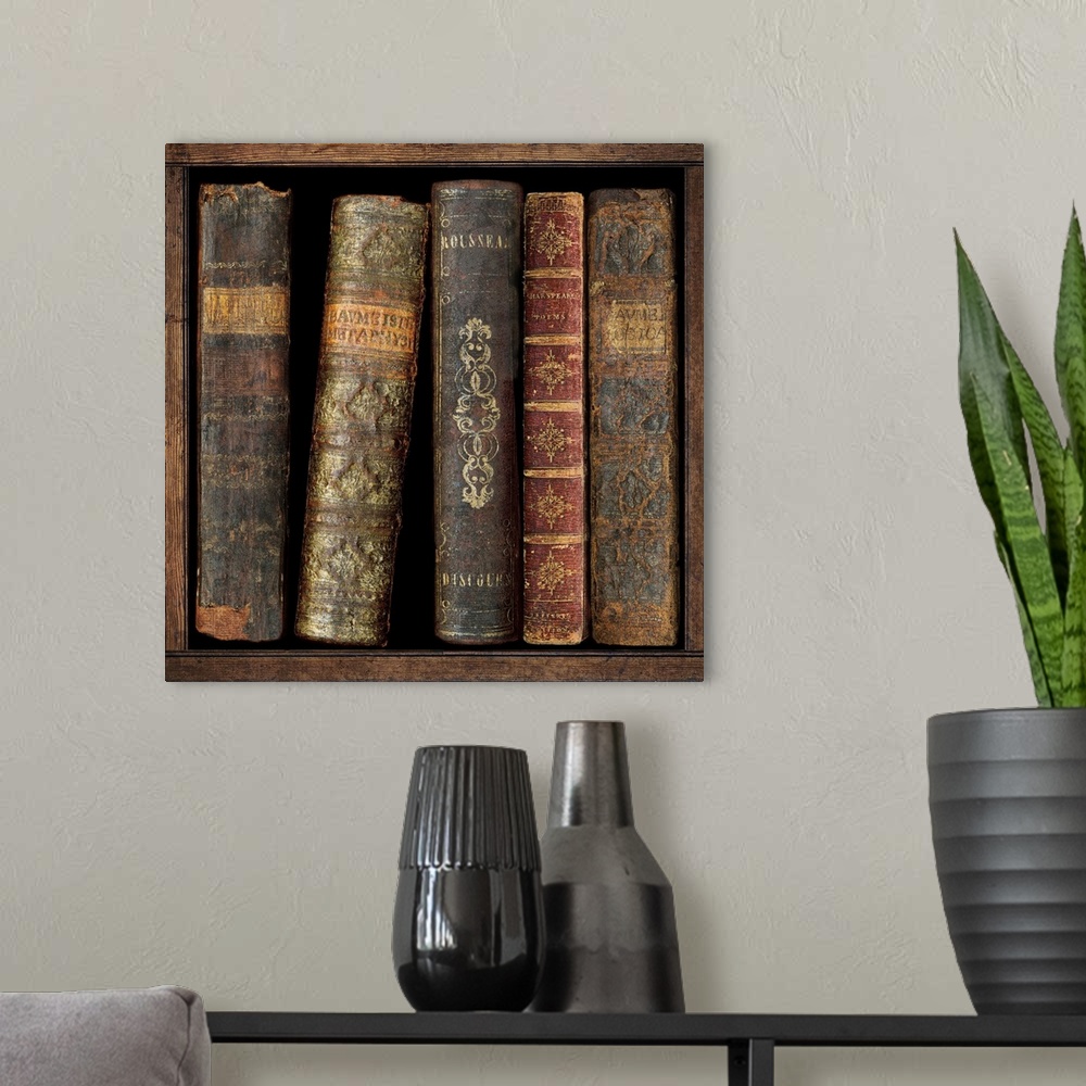 A modern room featuring Square decor with antique books on a shelf.