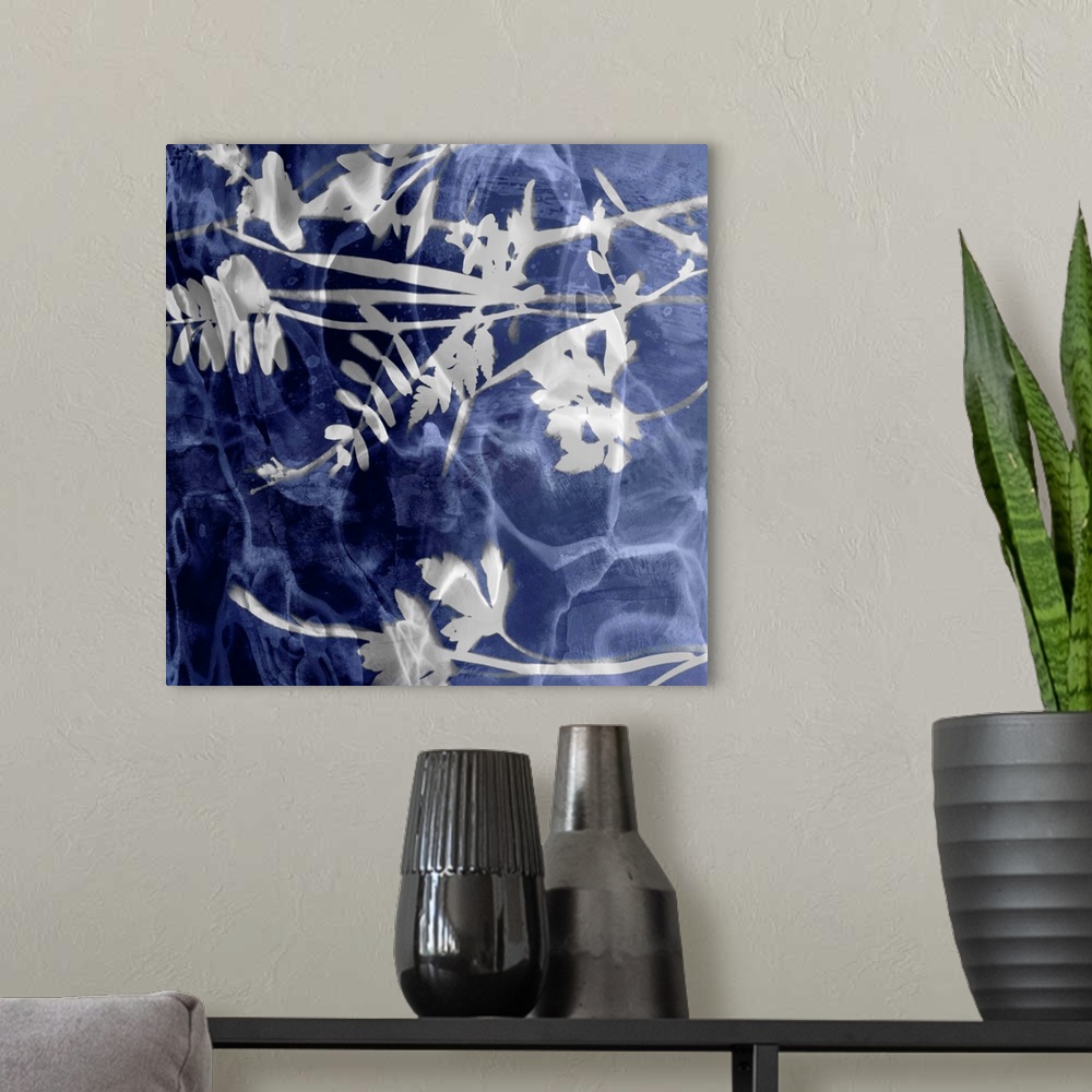 A modern room featuring Square home decor with silver silhouettes of leaves and flowers on an indigo background with a wa...