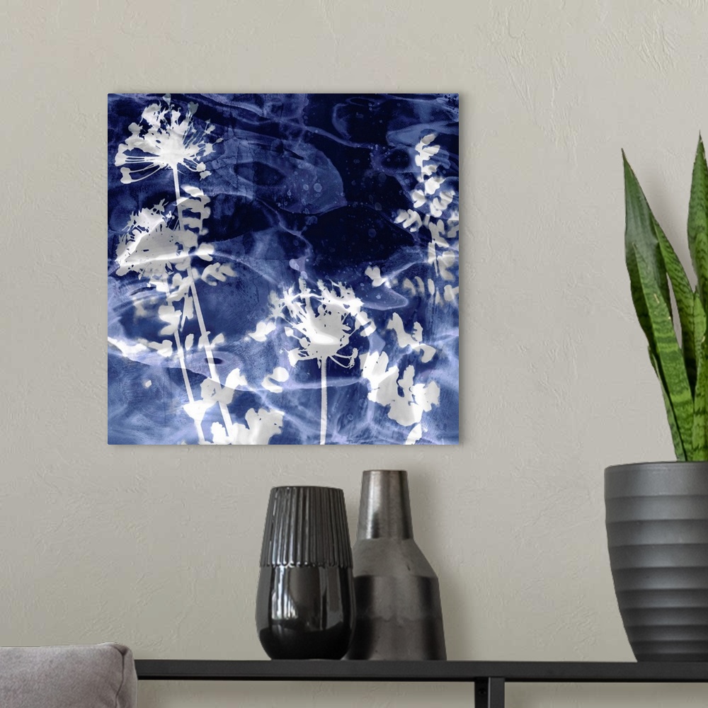 A modern room featuring Square home decor with silver silhouettes of leaves and flowers on an indigo background with a wa...