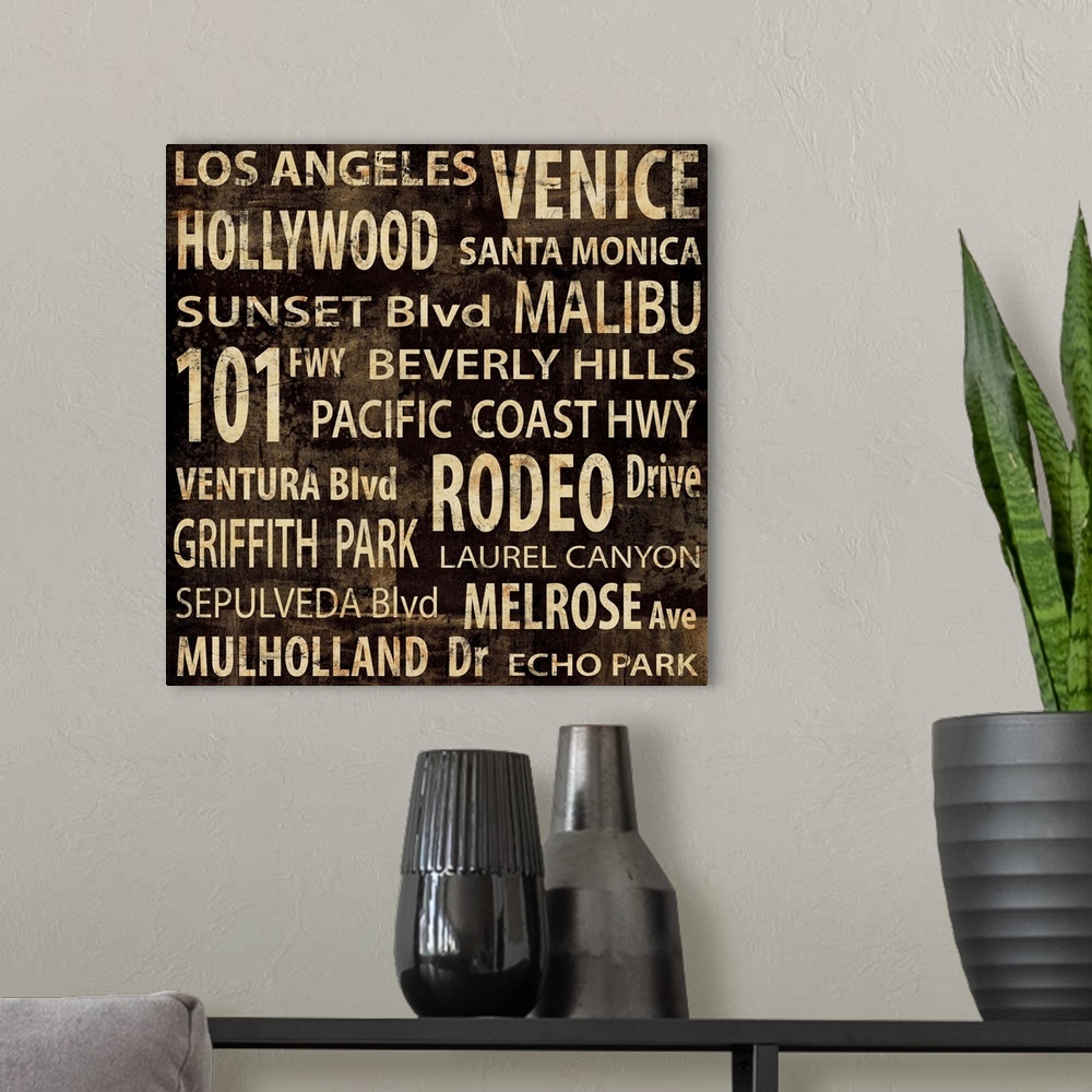 A modern room featuring Los Angeles typography in gold and brown.