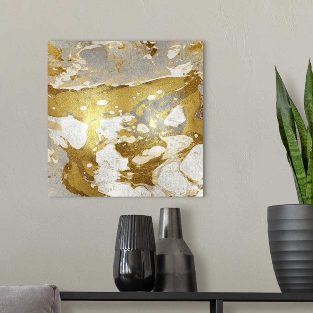 A modern room featuring Square abstract art in metallic silver, gold, and white.
