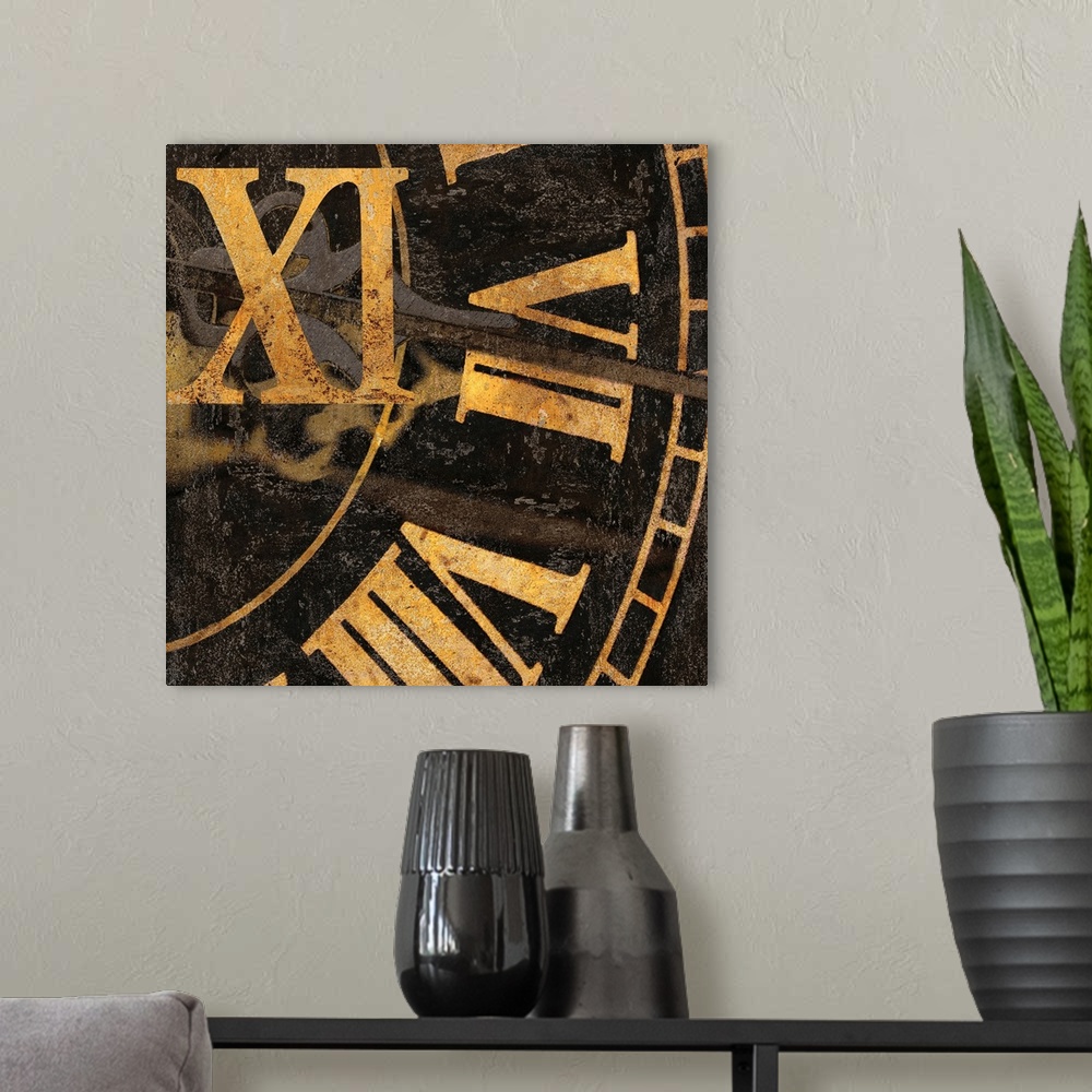 A modern room featuring Square decor with a close-up of gold roman numerals on a clock.