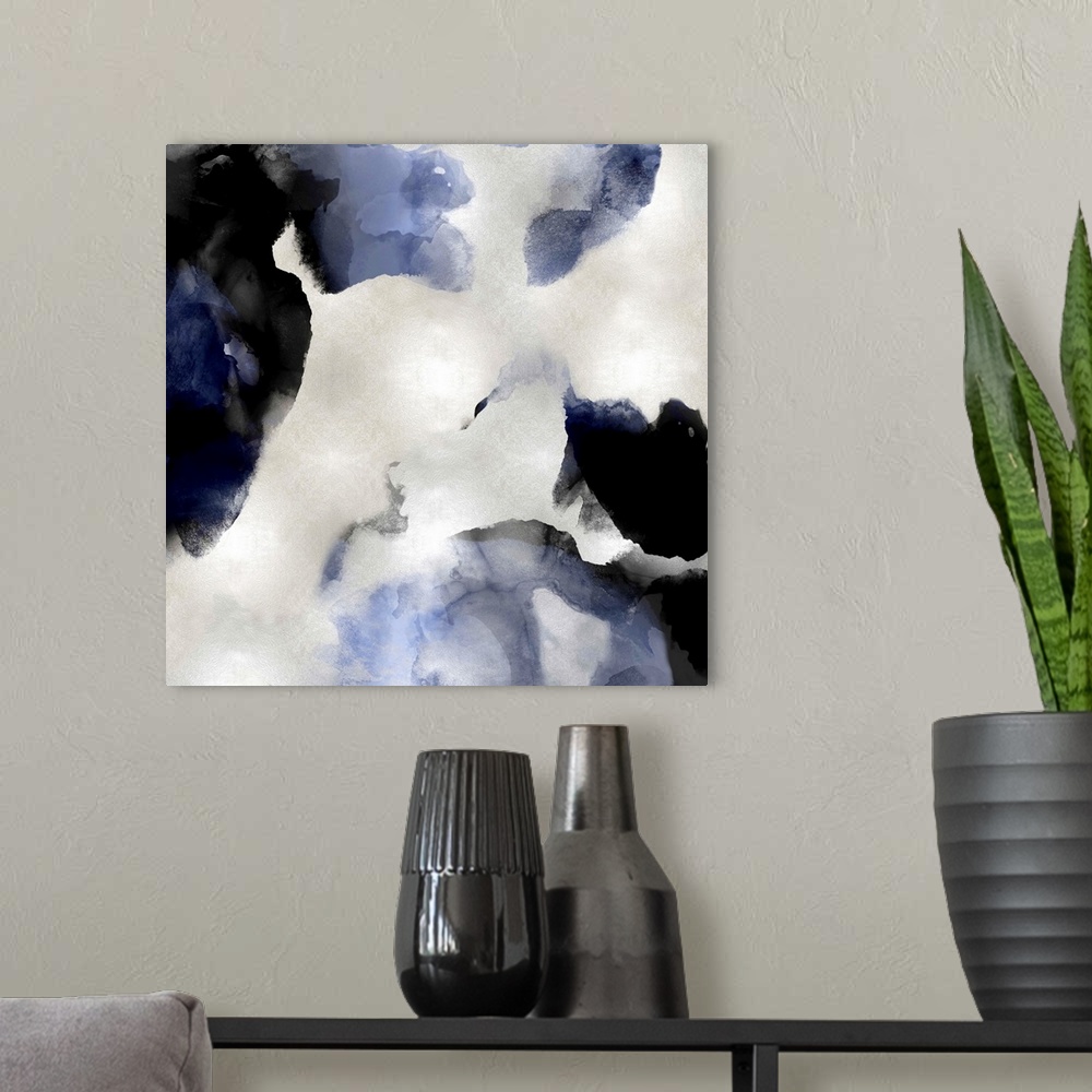 A modern room featuring Abstract painting with indigo and black hues splattered together on a silver background.