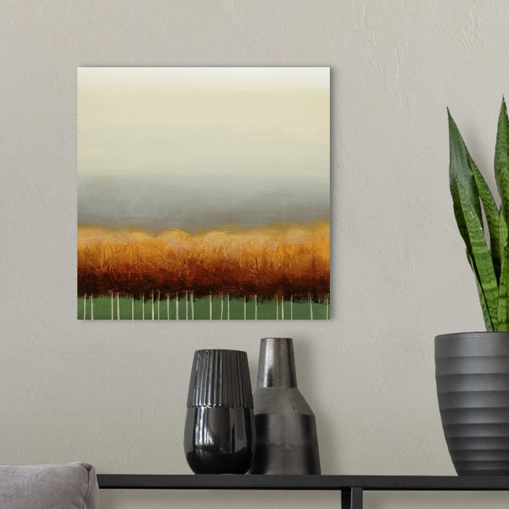 A modern room featuring Square painting of a grove of golden trees with a green background and a wide gray sky above.