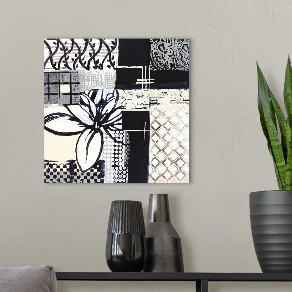 A modern room featuring Black and white painting of squared shapes of varies patterns and a large flower on the left.