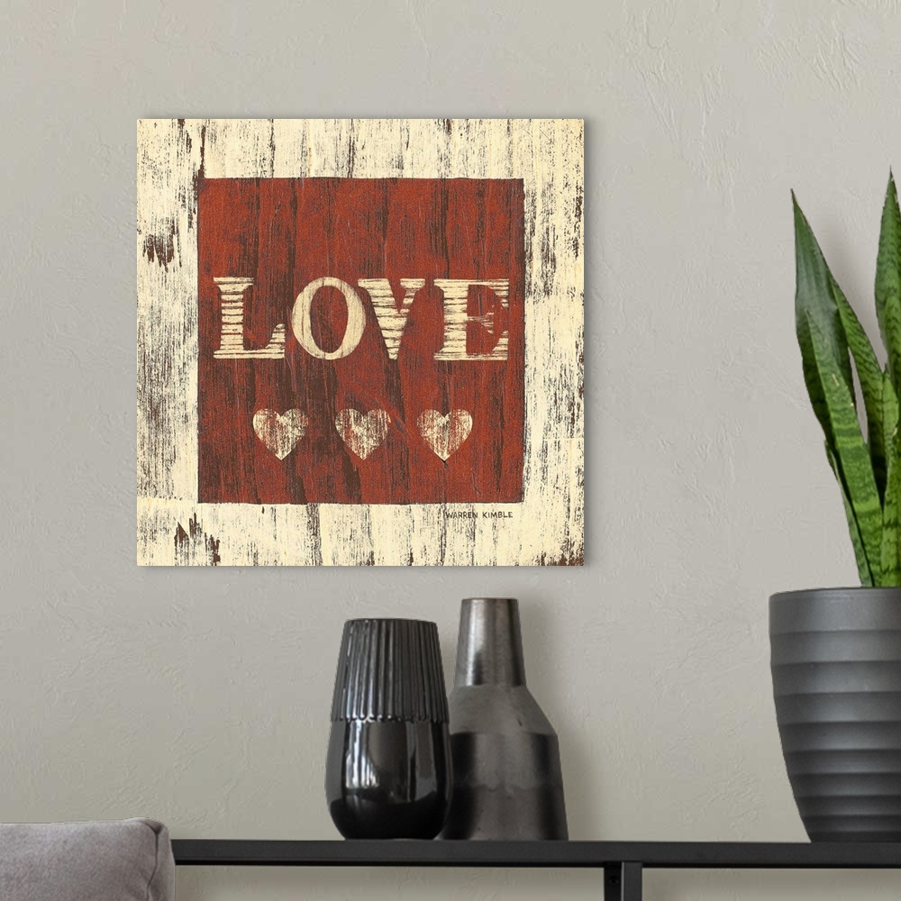 A modern room featuring Inspirational artwork of the word ""LOVE"" with three hearts underneath in a red square painted o...