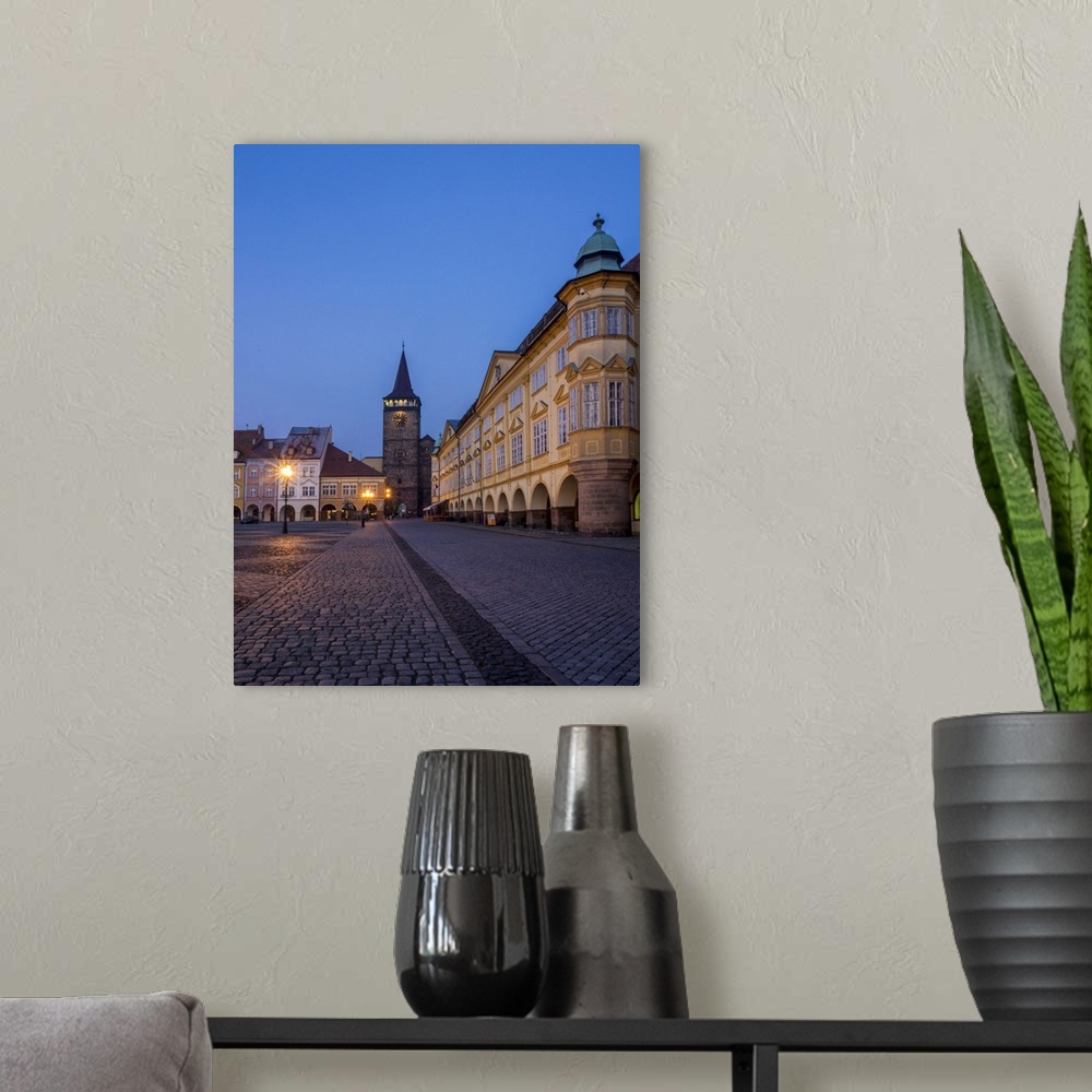 A modern room featuring Europe, Czech Republic, Jicin. Twilight in the main square surrounded with recently restored hist...