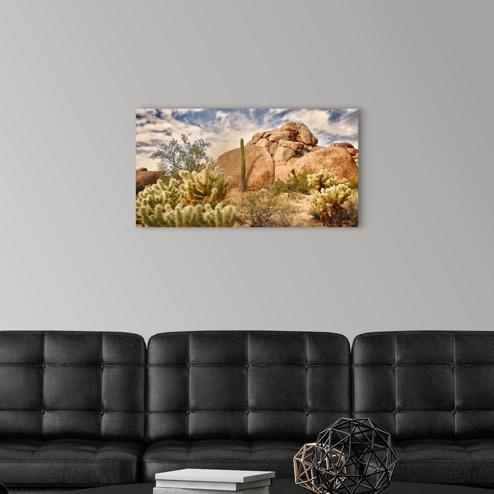 A modern room featuring Beautiful desert landscape with red rock buttes and glowing sky with little fluffy clouds.