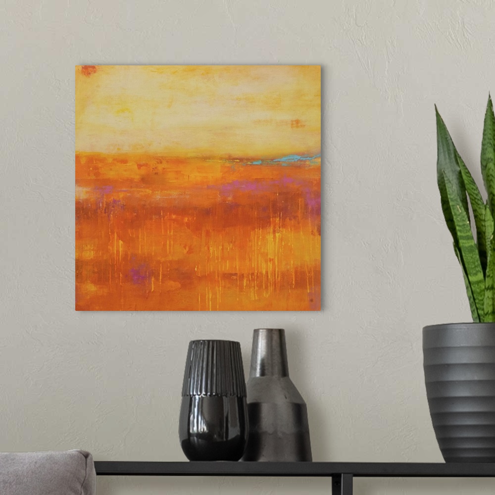 A modern room featuring A contemporary abstract painting using a pale orange and a dark orange meeting face to face.