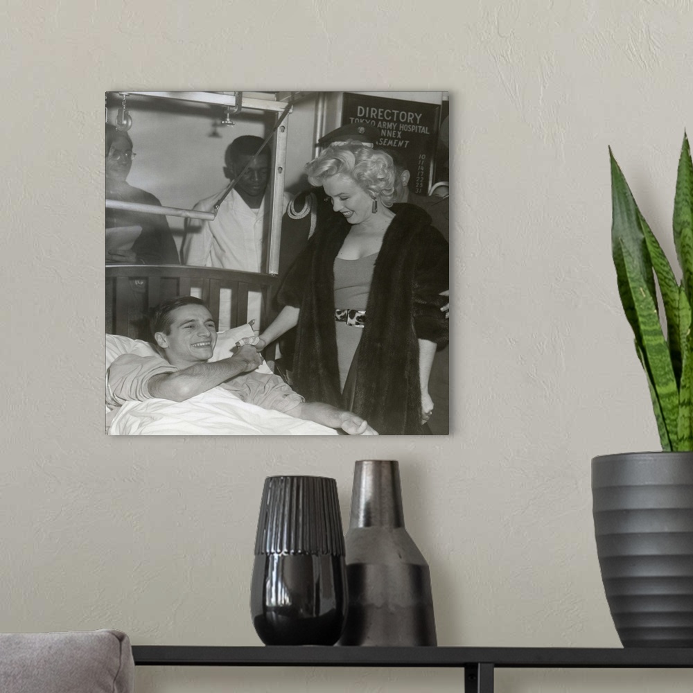 A modern room featuring Marilyn Monroe Visiting Wounded Soldier In Hospital In Japan.